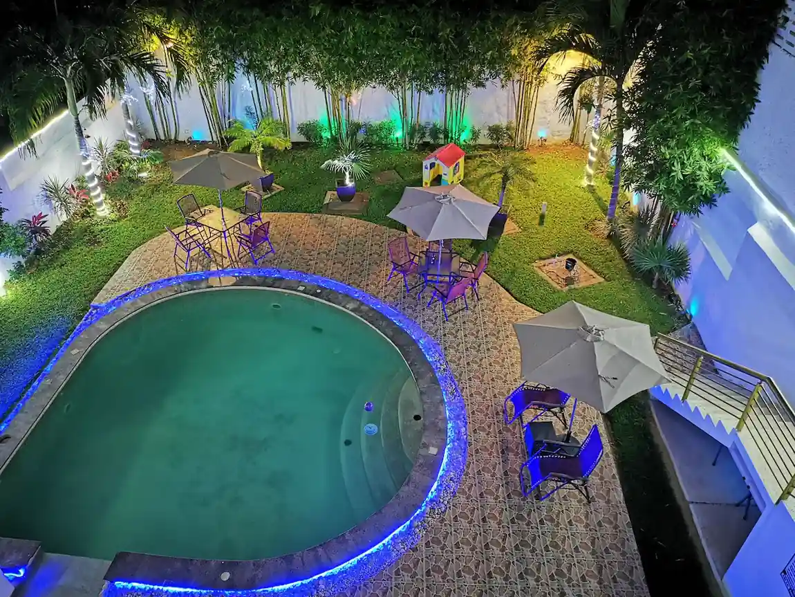 Garden and outdoor swimming pool at Hotel Real Mercedes in Mérida